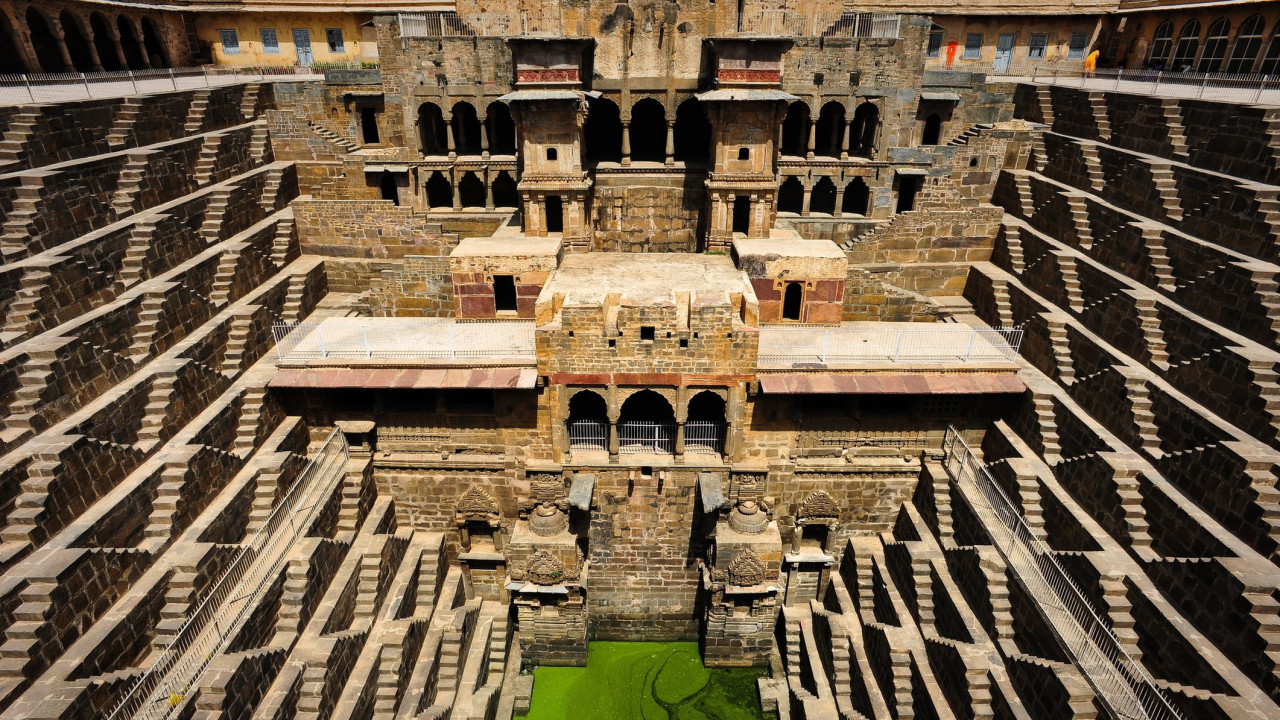 A shot of the incredible Chand Baori Stepwell and it's temple, Abhaneri, Rajasthan, India