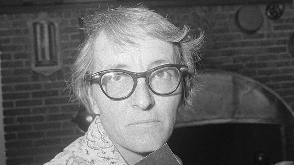 Elisabeth Kübler-Ross holding two of her books