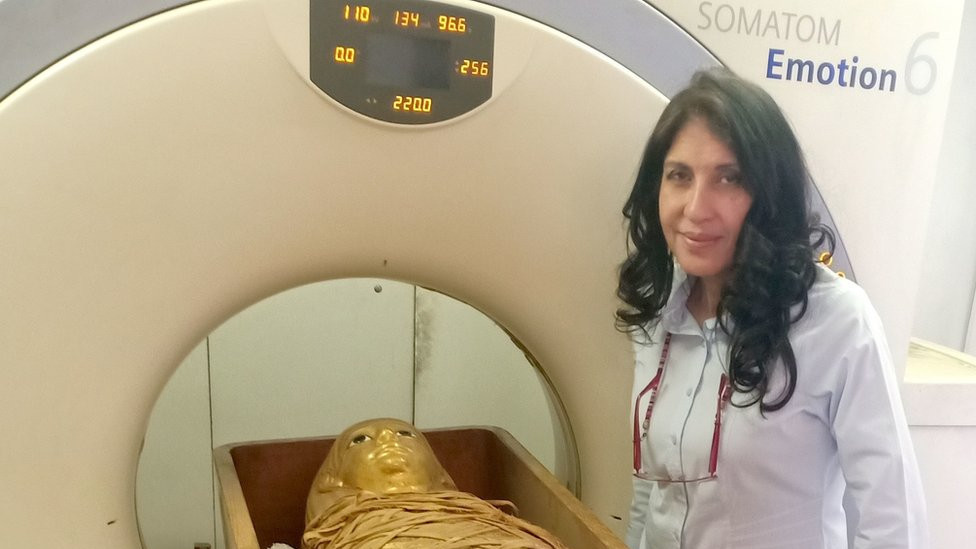 Dr Sahar Saleem, professor of radiology at Cairo University's Kasr Al-Ainy Faculty of Medicine, stands next to the mummy of Amenhotep I and a CT scanner