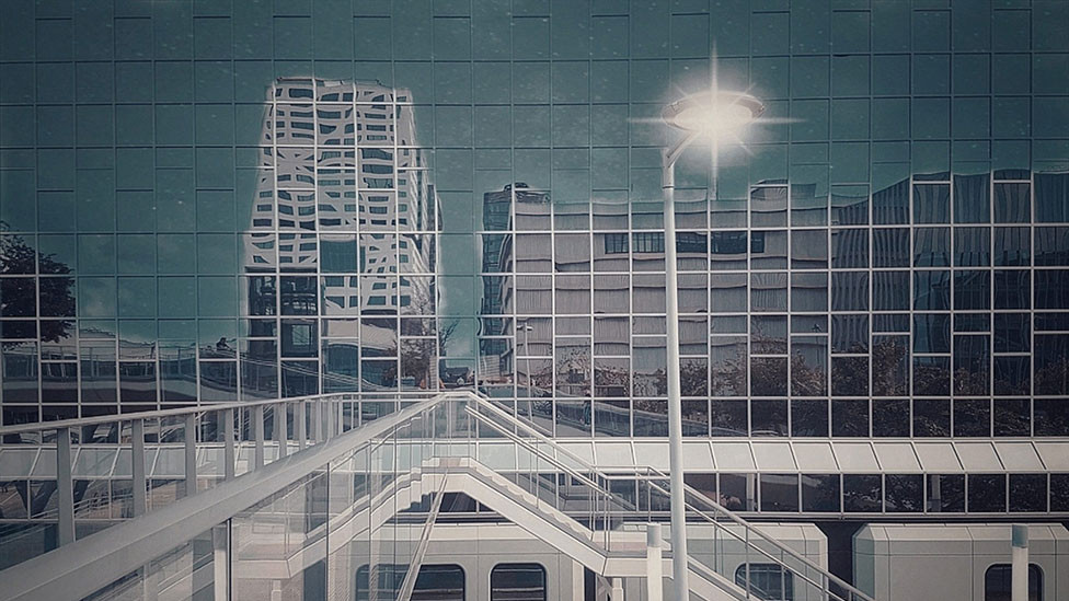 Buildings reflected in the glass side of a building in Netherlands