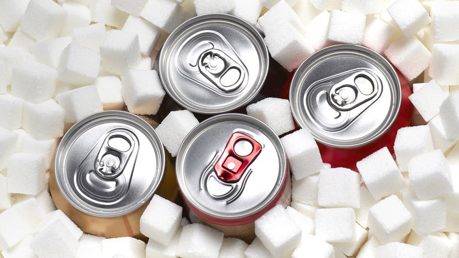 Cans of sugary soft drinks