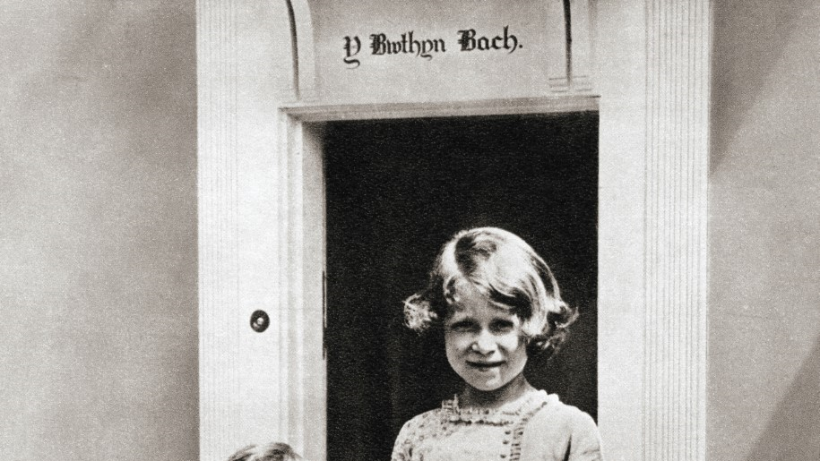 Princess Elizabeth, right, and her sister Princess Margaret in 1933 at Y Bwthyn Bach or The Little House, situated in the garden of the Royal Lodge, Windsor Great Park, Berkshire, England.