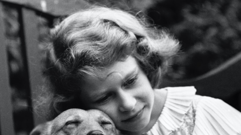 Princess Elizabeth, aged 10, with her pet dog, London.