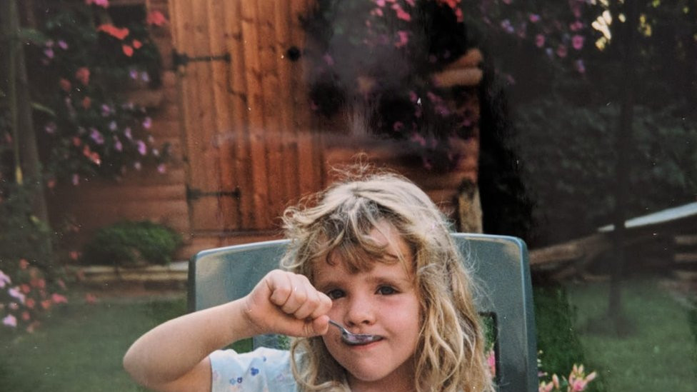 Loretta eating breakfast in her grandmother's garden