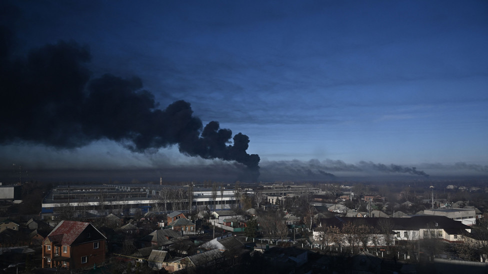 Black smoke rises from a military airport in Chuguyev near Kharkiv on February 24, 2022
