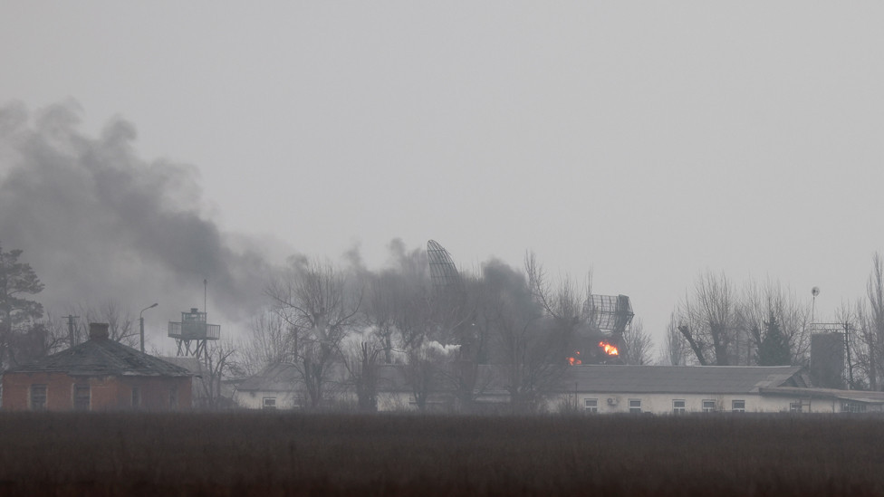 Smoke is seen coming out of a military installation near the airport, after Russian President Vladimir Putin authorized a military operation in eastern Ukraine, in Mariupol, 24 February 2022