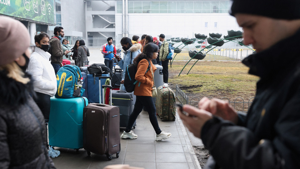 People wait at Kyiv Airport on 24 February 2022