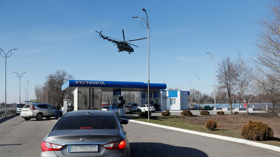Ukrainian military helicopter flies over a gas station, after Russian President Vladimir Putin authorized a military operation in eastern Ukraine, outside the city of Dnipro, Ukraine 24 February 2022