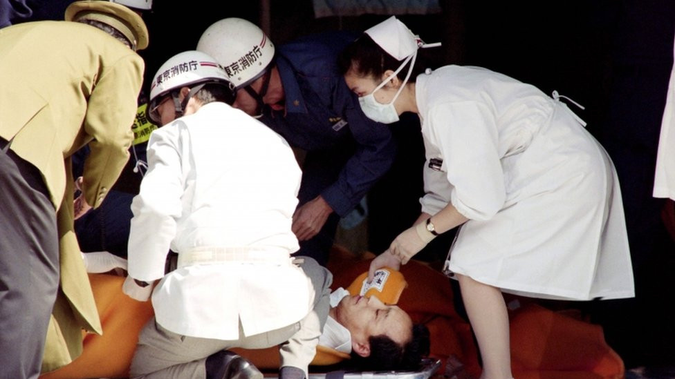 A commuter is treated by an emergency medical team at a make-shift shelter before being transported to hospital after being exposed to sarin gas fumes in the March 1995 Tokyo subway attack