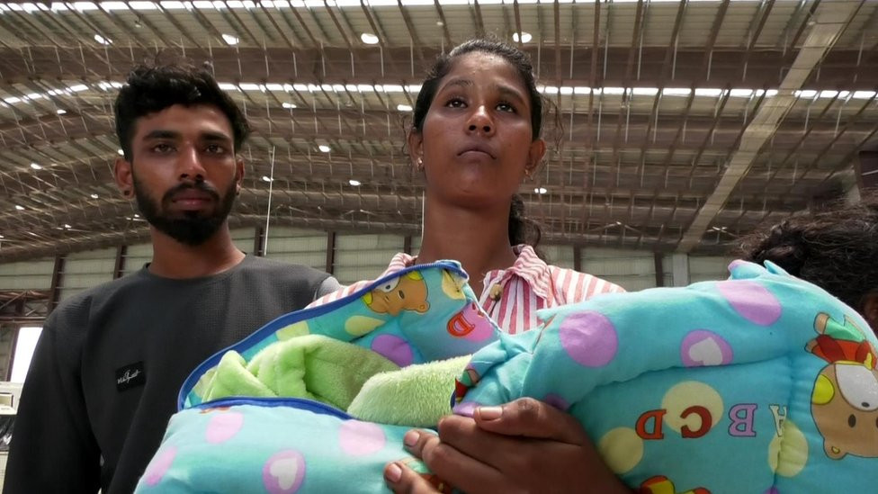 Clara with her husband and baby