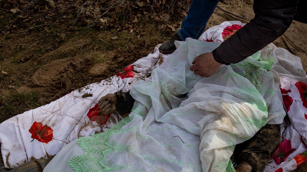 Volodymyr replaces the thin sheet that covered the body where it lay