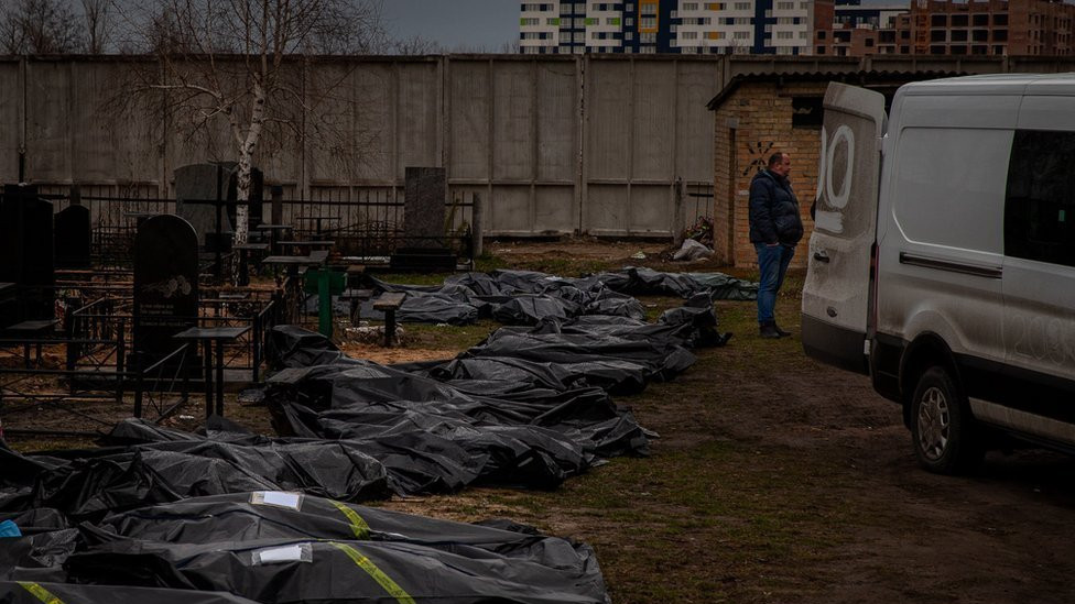 The line of body bags at the Bucha cemetery, waiting to be processed and buried.