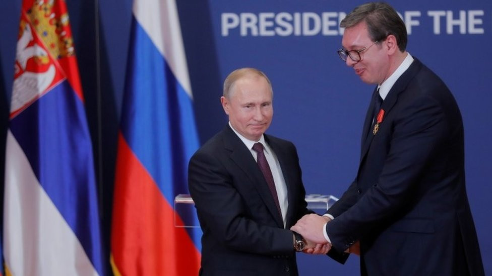 Russian President Vladimir Putin decorates Serbian President Aleksandar Vucic with an order of Alexander Nevsky after their meeting in Belgrade in January