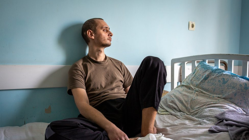 Nikita Horban sits in a medical facility in Zaporizhzhya. "It still hurts," he said. "The wounds are still fresh."