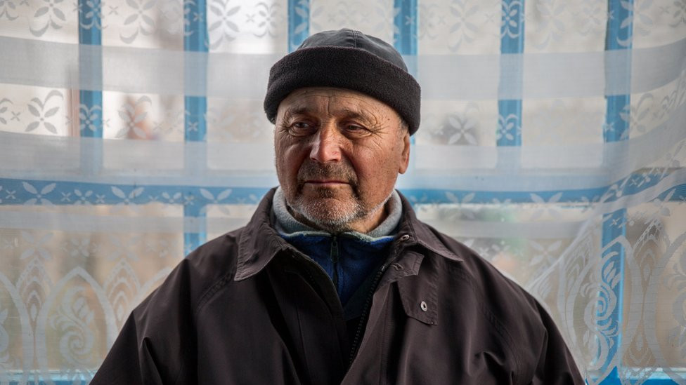 Volodymyr Holumenkov at Sasha and Nikita's home in the village. "Everyone here is going through their own grief," he said.