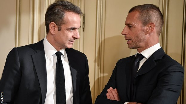 Greek Prime Minister Kyriakos Mitsotakis talks with Uefa president Aleskander Ceferin in February 2020
