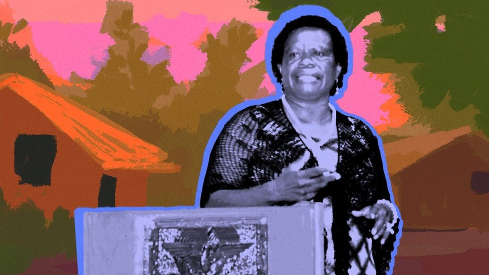 Monica Paulus at a podium with an illustrated background