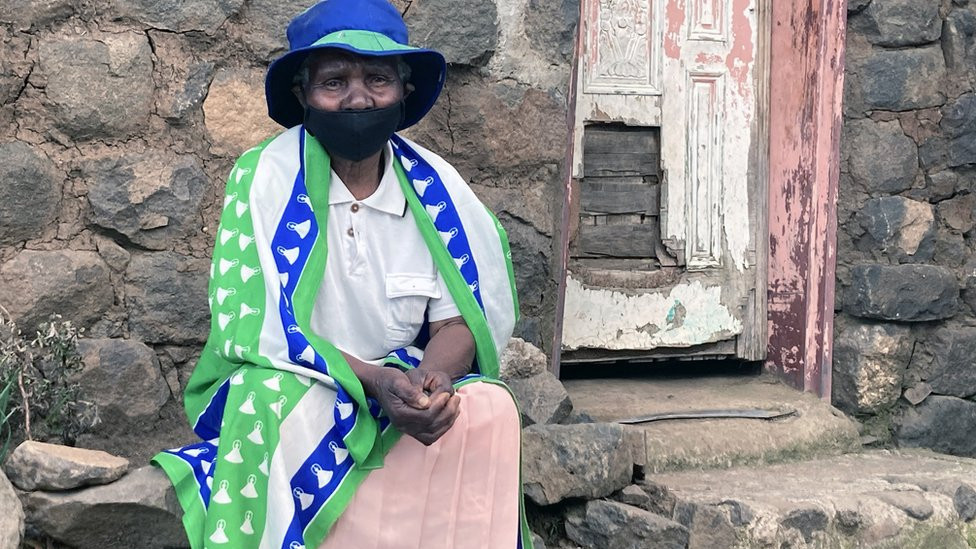 Mantolo Semano outside her cottage