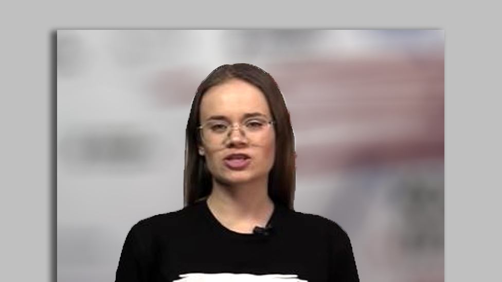 Female presenter wearing black t-shirt bearing the letter "Z"