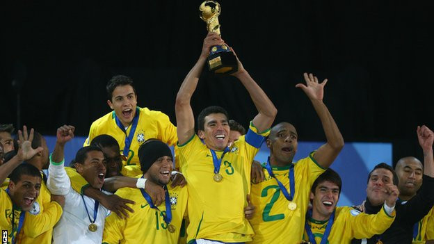 Lucio lifts the 2009 Confederations Cup trophy, with an 'I Love Jesus' T-Shirt draped over his shorts