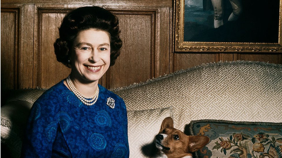 Queen Elizabeth II with one of her corgis at Sandringham, 1970