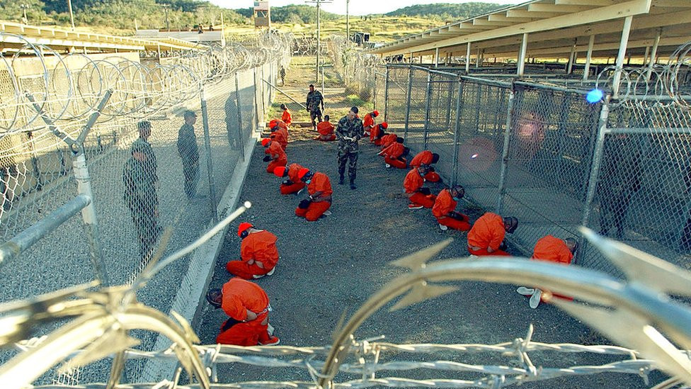 Detainees in orange jumpsuits at the detention camp at Guantanamo Bay, in January 2002.
