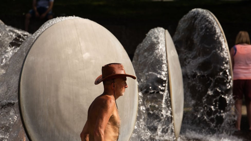Image shows man in cowboy hat