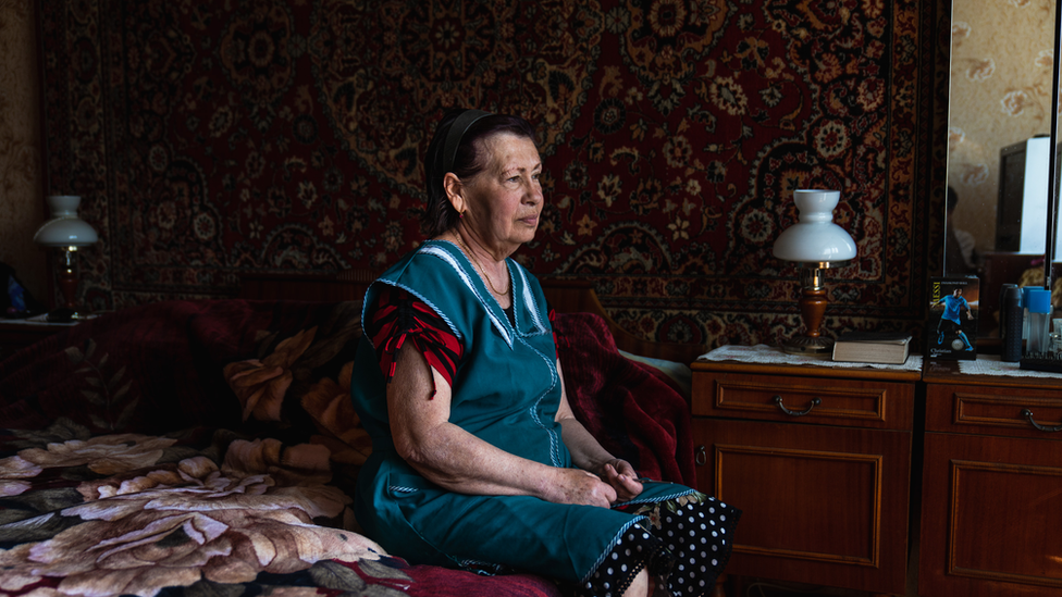 Tamara sits in her bedroom in her half-destroyed building. “It was a beautiful here," she said. "Now there is nothing left"