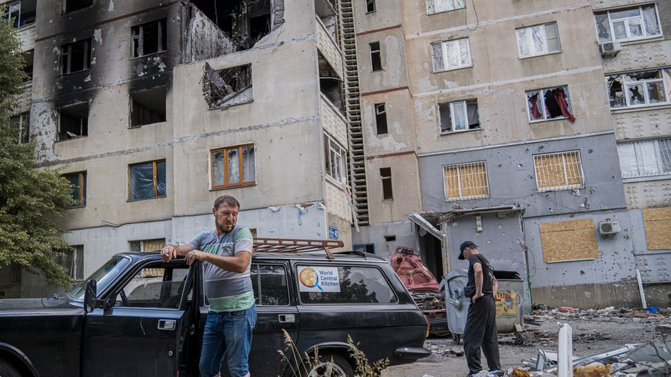Food delivery volunteer Leon Petrosyan smokes a cigarette. "The people here have nowhere else to go," he said. "They are trapped"