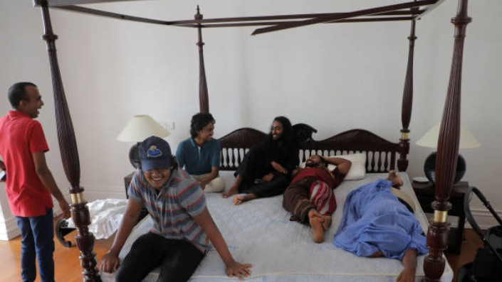 Visitors try out the bed at the Sri Lankan Presidentâs official residence that was stormed by protestors in Colombo, Sri Lanka