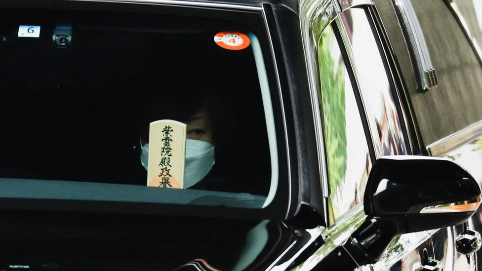 Akie Abe, wife of late former Japanese Prime Minister Shinzo Abe, who was shot while campaigning for a parliamentary election, sits in a vehicle carrying Abe's body, as she leaves after his funeral at Zojoji Temple in Tokyo, Japan July 12, 2022.