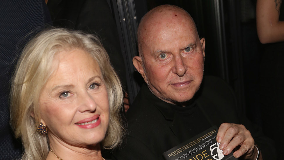 Mark Fleischman with wife Mimi with his book Inside Studio 54 in 2017