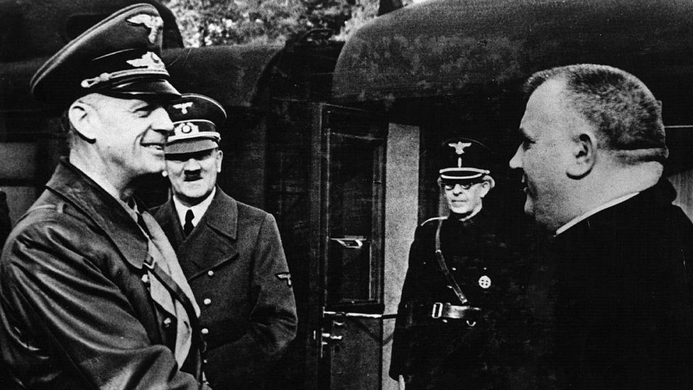 German Foreign Minister Joachim Von Ribbentrop greeting Jozef Tiso (R) as Adolf Hitler looks on