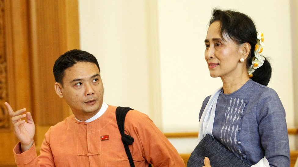 National League for Democracy party (NLD) leader Aung San Suu Kyi and Member of Parliament Thaw leave after attending a lower house of parliament meeting at Naypyitaw