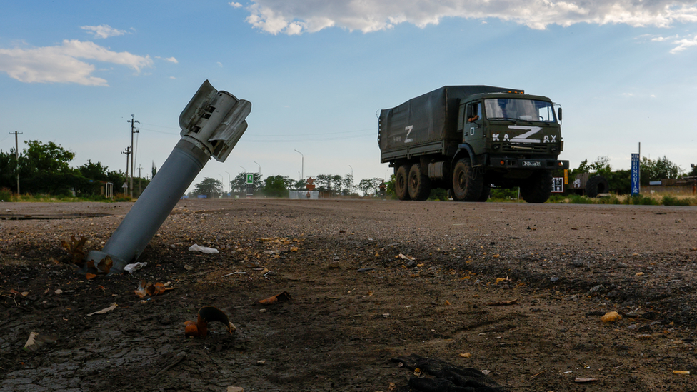 Smoke rises behind vessels on the Dnipro River during Ukraine-Russia conflict in the Russia-controlled city of Kherson, Ukraine on 24 July 2022