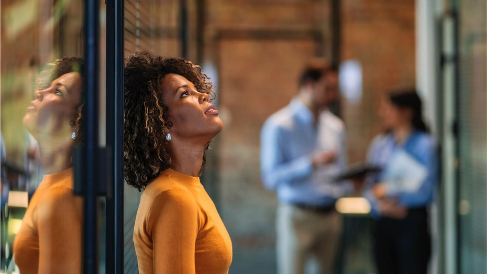 Fed up woman at work