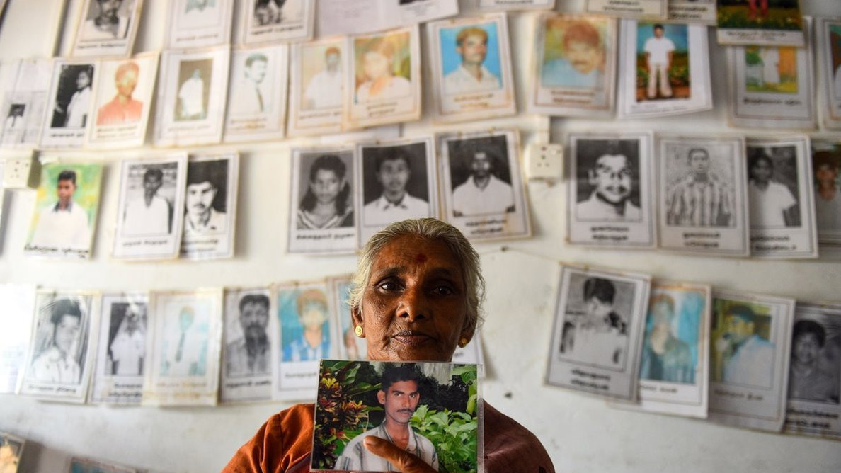 A Sri Lankan Tamil woman holds a picture of a missing loved one at the Missing people organization office in the district of Mullaittivu on May 17, 2019, ahead of the 10th anniversary of Sri Lankan troops defeating Tamil Tiger rebels and declaring an end to a 37-year-old separatist war that claimed at least 100,000 lives. - Sri Lanka marks on May 18 and 19 a decade since the end of its 37-year Tamil separatist war that claimed at least 100,000 lives. (Photo by ISHARA S. KODIKARA / AFP) (Photo credit should read ISHARA S. KODIKARA/AFP via Getty Images)