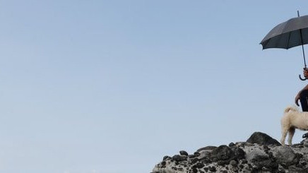 A man - not quoted in this story - looks towards Chinese military drills from the Taiwanese coast