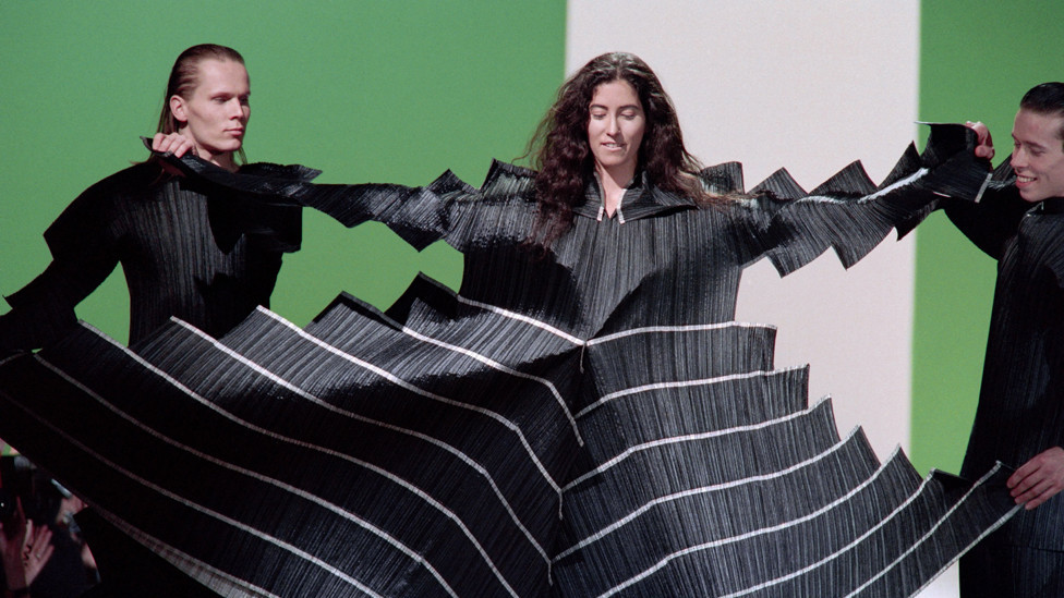 Models display a Pleats Please dress as part of Issey Miyake's Ready-to-Wear Autumn-Winter 1995 fashion show in Paris, France