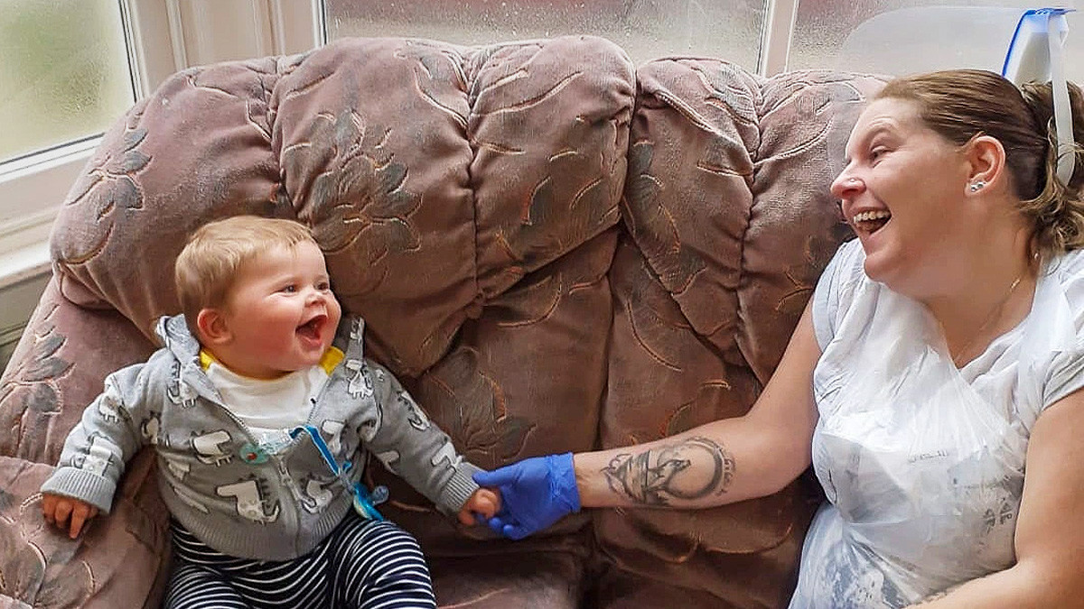 Laura with Leiland-James in the contact centre