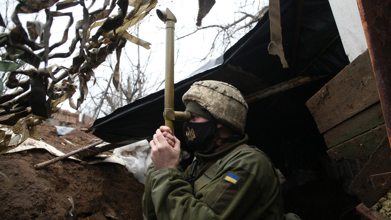 Ukrainian soldier stands guard in the Donetsk region