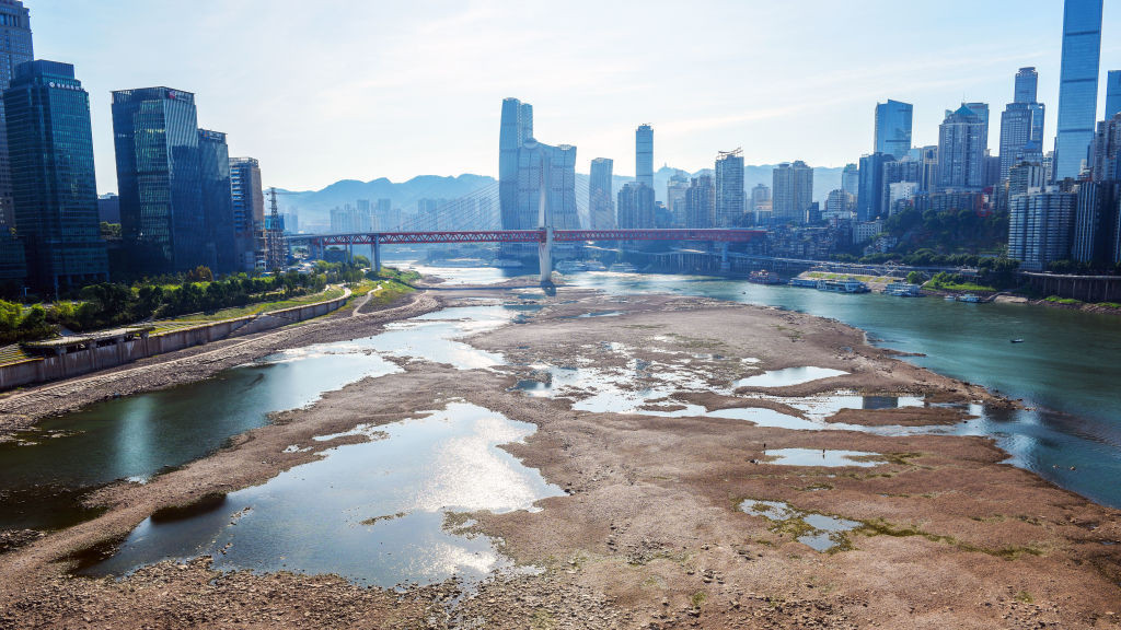 The Jialing River bed at the confluence with the Yangtze River is exposed due to drought on August 18, 2022 in Chongqing, China. The water level of the Jialing River, one of the tributaries of the Yangtze River, has dropped due to high temperature and drought