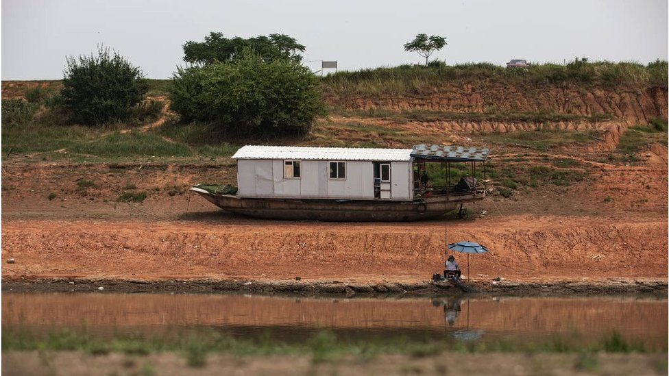 A houseboat rests on the river bed as China's Yangtze river dries up