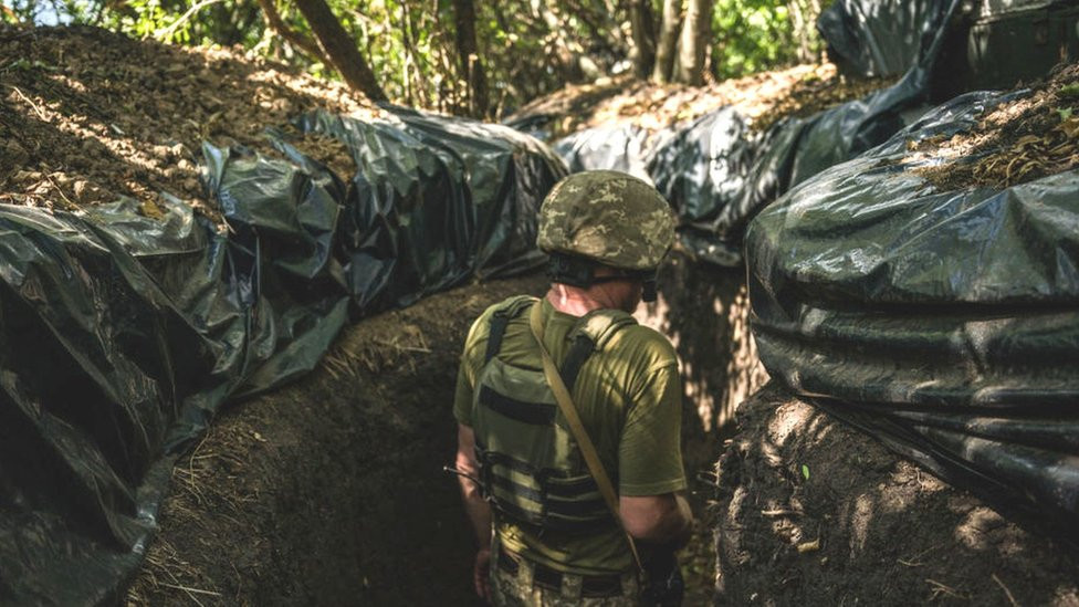 Ukrainian soldier in trenches on Kherson front