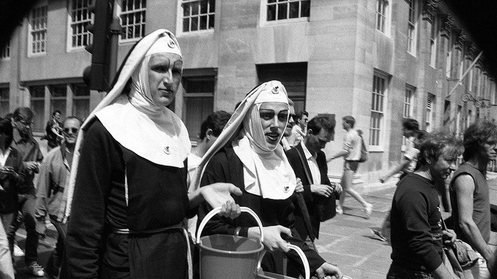 People attend the Pride march in 1983