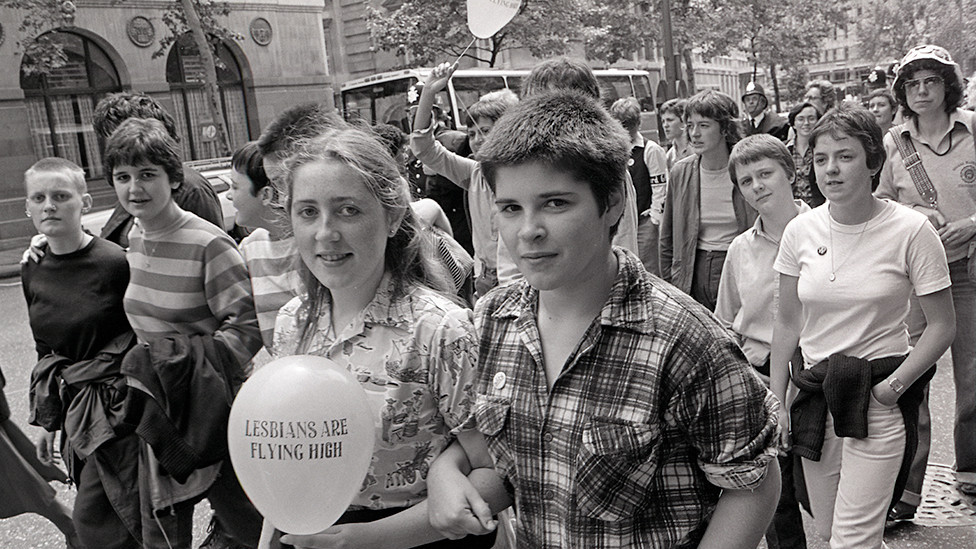 People attend the Pride march in 1980