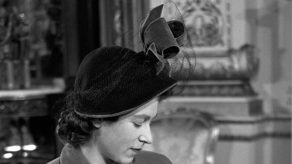 Princess Elizabeth holds her son Prince Charles after his Christening ceremony in Buckingham Palace, 1948