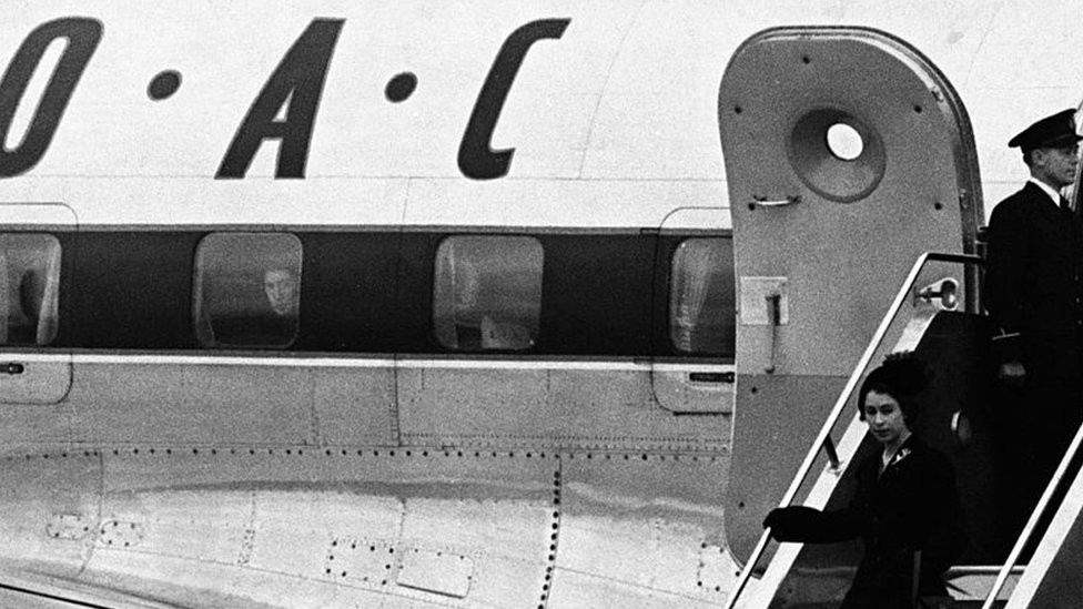 The Queen arrives back in Britain from Nairobi following the death of her father George VI, and is met by the politicians (second l to r) Lord Woolton, Anthony Eden, Clement Atlee and Winston Churchill.