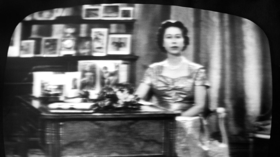 The Queen seen on a television screen as she concludes what became her traditional Christmas day broadcast to her people, which was televised in 1957 for the first time and carried by both the BBC and ITV.