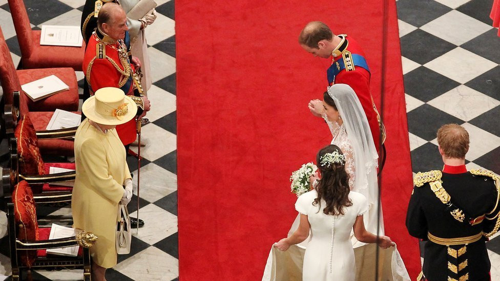 Prince William Duke of Cambridge and Catherine Duchess of Cambridge bow in front of Queen Elizabeth II at Westminster Abbey on April 29, 2011 in London, England.